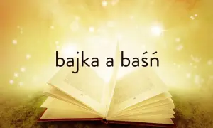 Otwarta książka z napisem "bajka a baśń" na tle złotych promieni i gwiazdek.